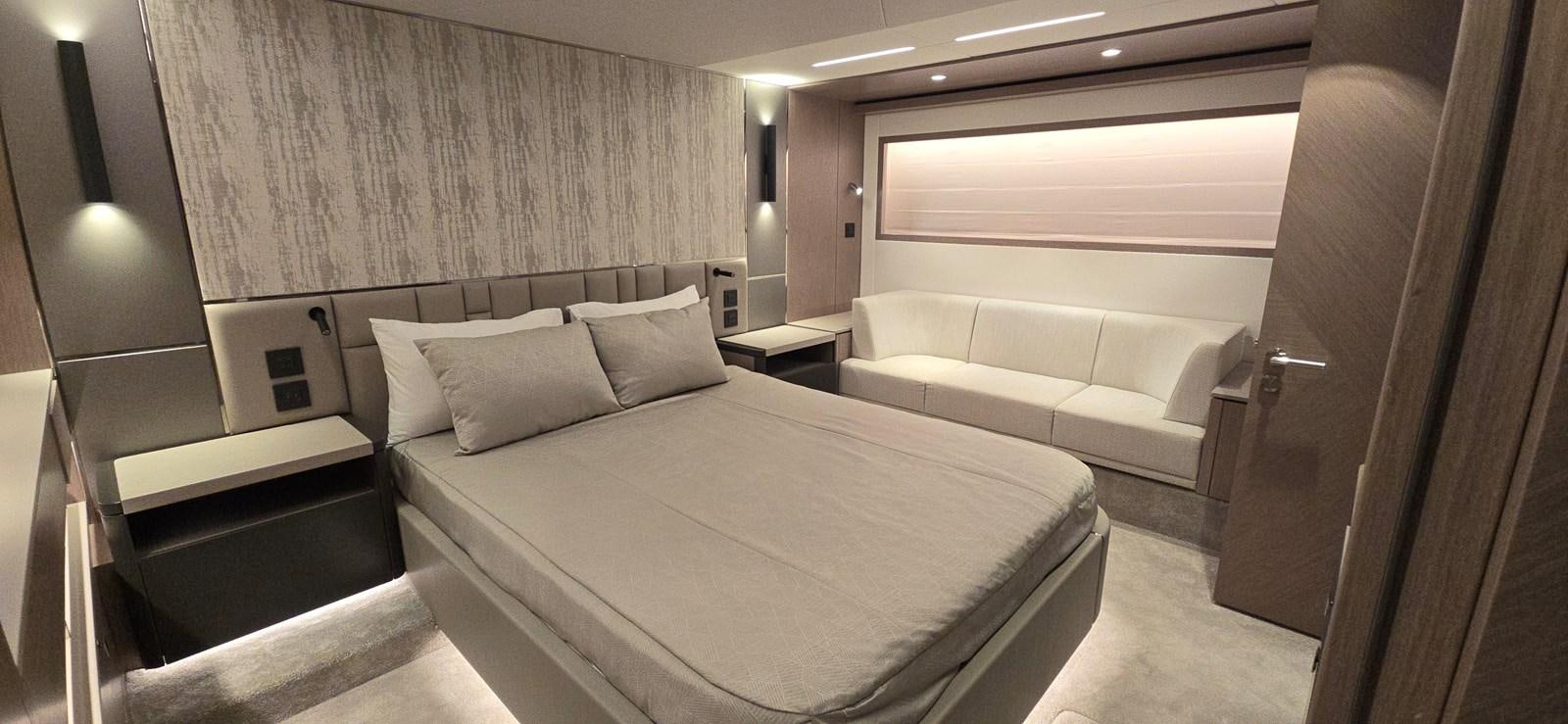 a room with a bed and a desk aboard GABY Yacht for Sale