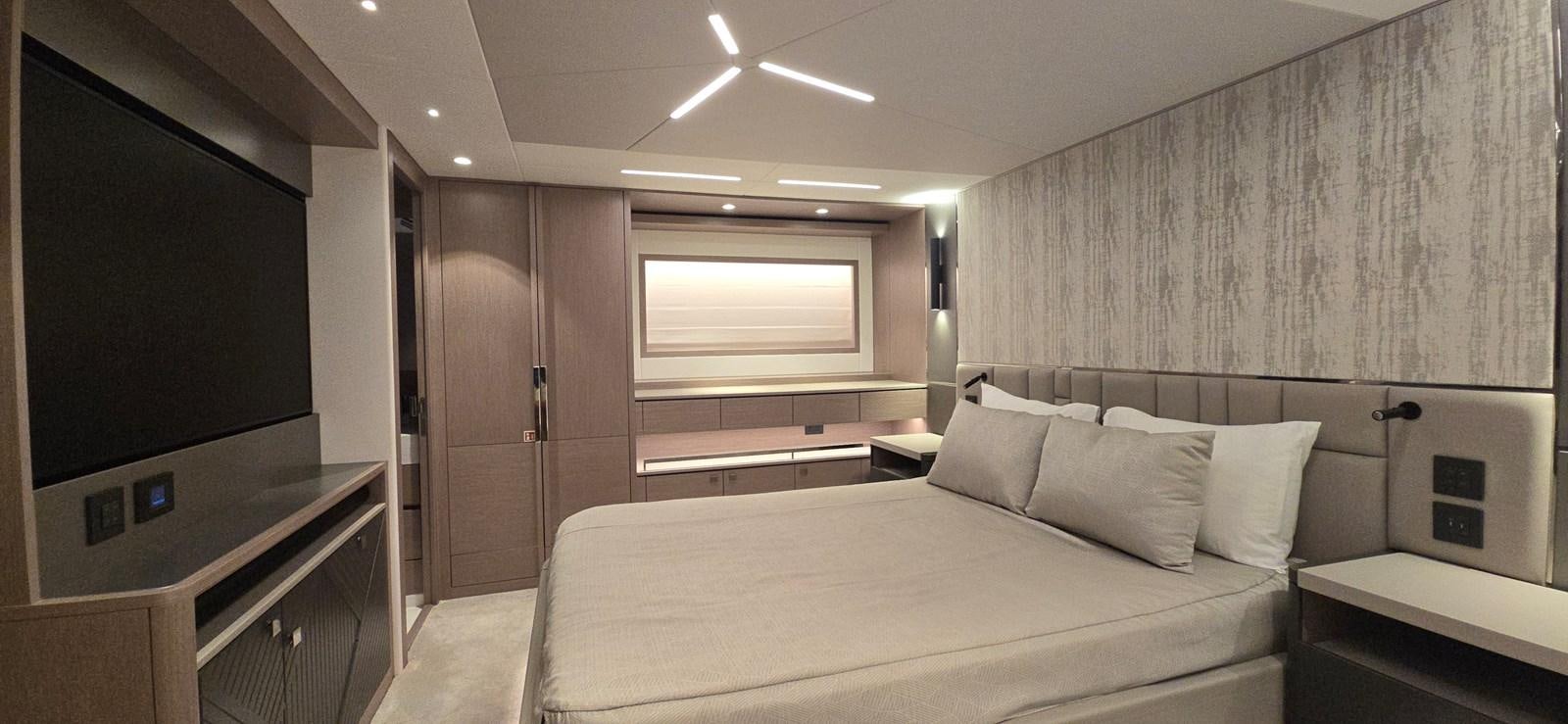 a room with a bed and a tv aboard GABY Yacht for Sale