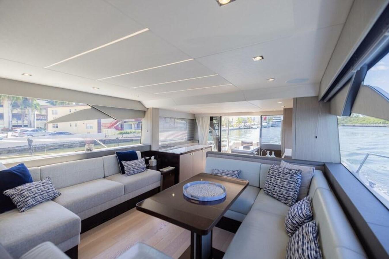 a living room with a large window aboard SEA ZAR Yacht for Sale