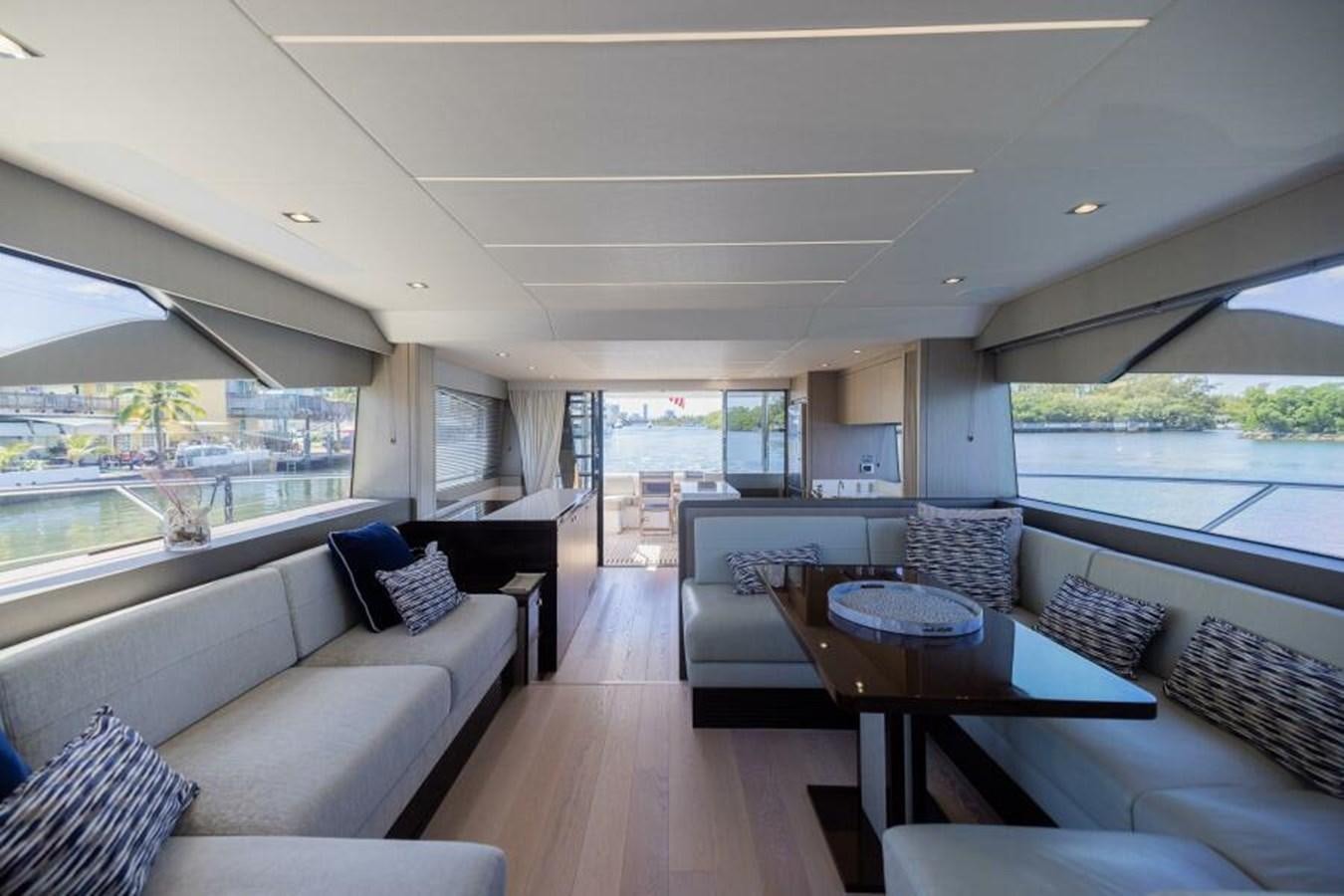 a living room with a large window aboard SEA ZAR Yacht for Sale