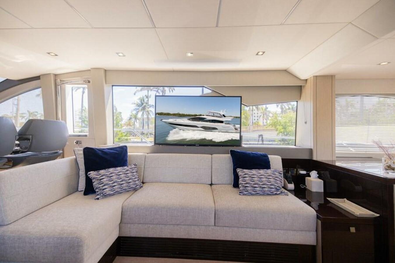 a living room with a large window aboard SEA ZAR Yacht for Sale