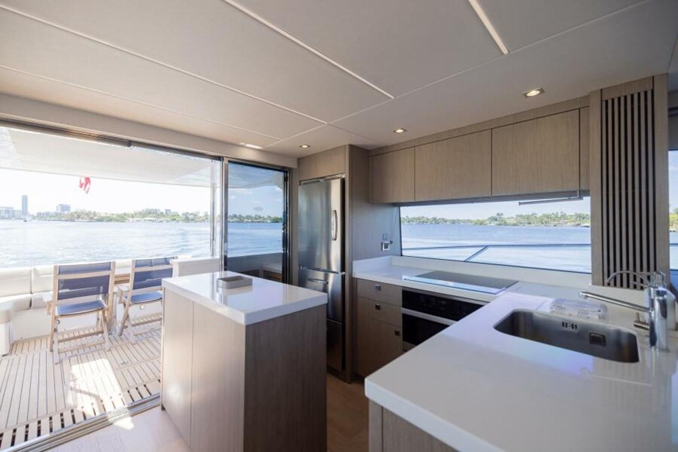 a kitchen with a large window aboard SEA ZAR Yacht for Sale