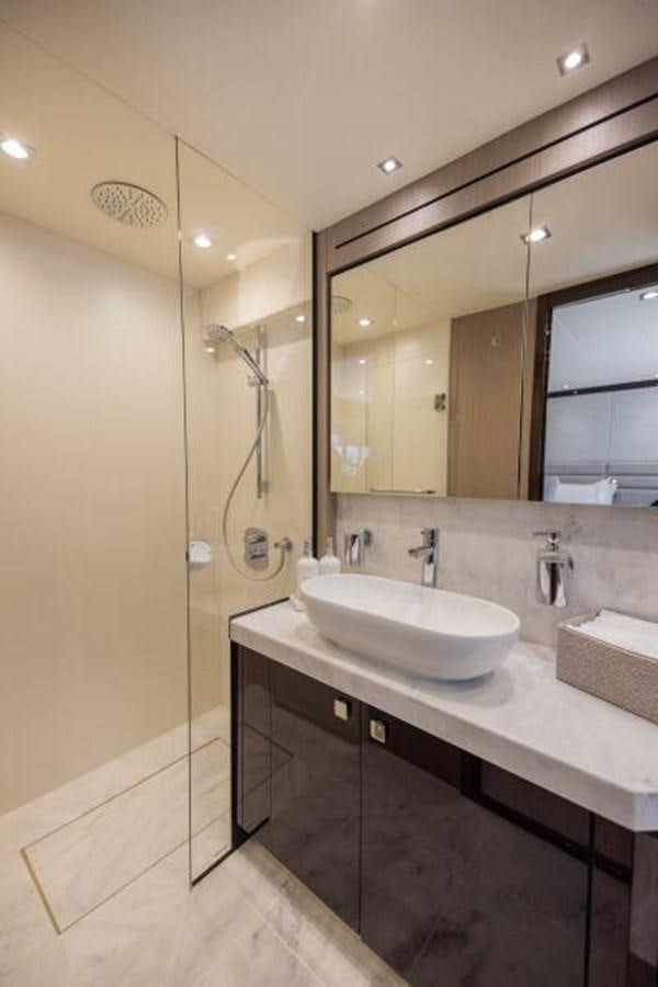 a bathroom with a sink and a mirror aboard SEA ZAR Yacht for Sale