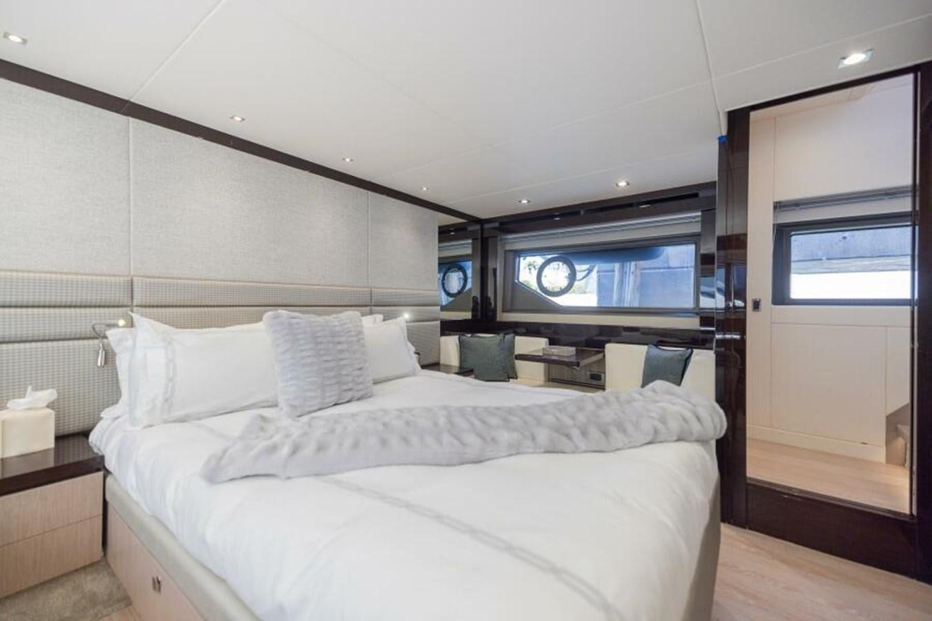 a bedroom with a bed and a television aboard SEA ZAR Yacht for Sale