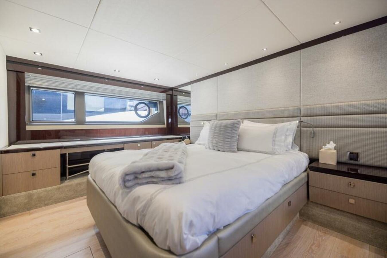 a room with a bed and a television aboard SEA ZAR Yacht for Sale
