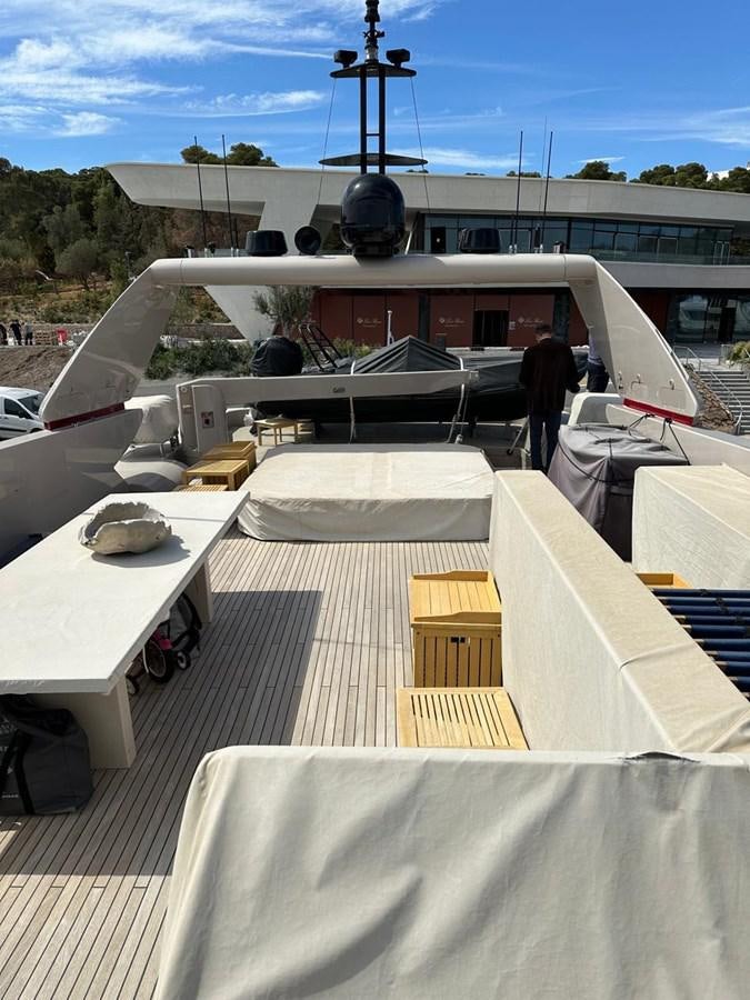 a person standing on a deck aboard CHRISTINA V Yacht for Sale