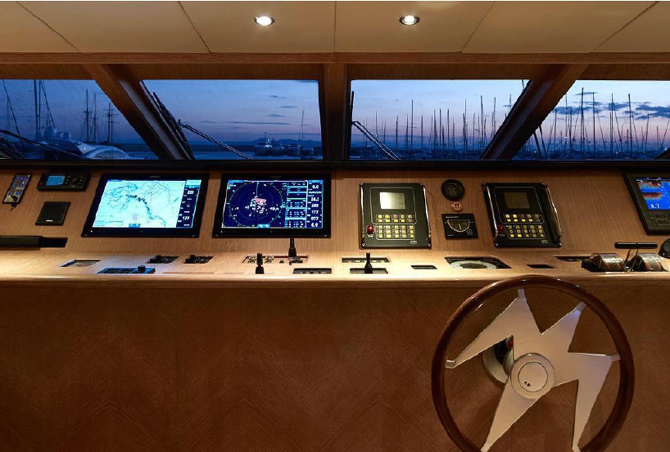 a control room with several monitors aboard CHRISTINA V Yacht for Sale