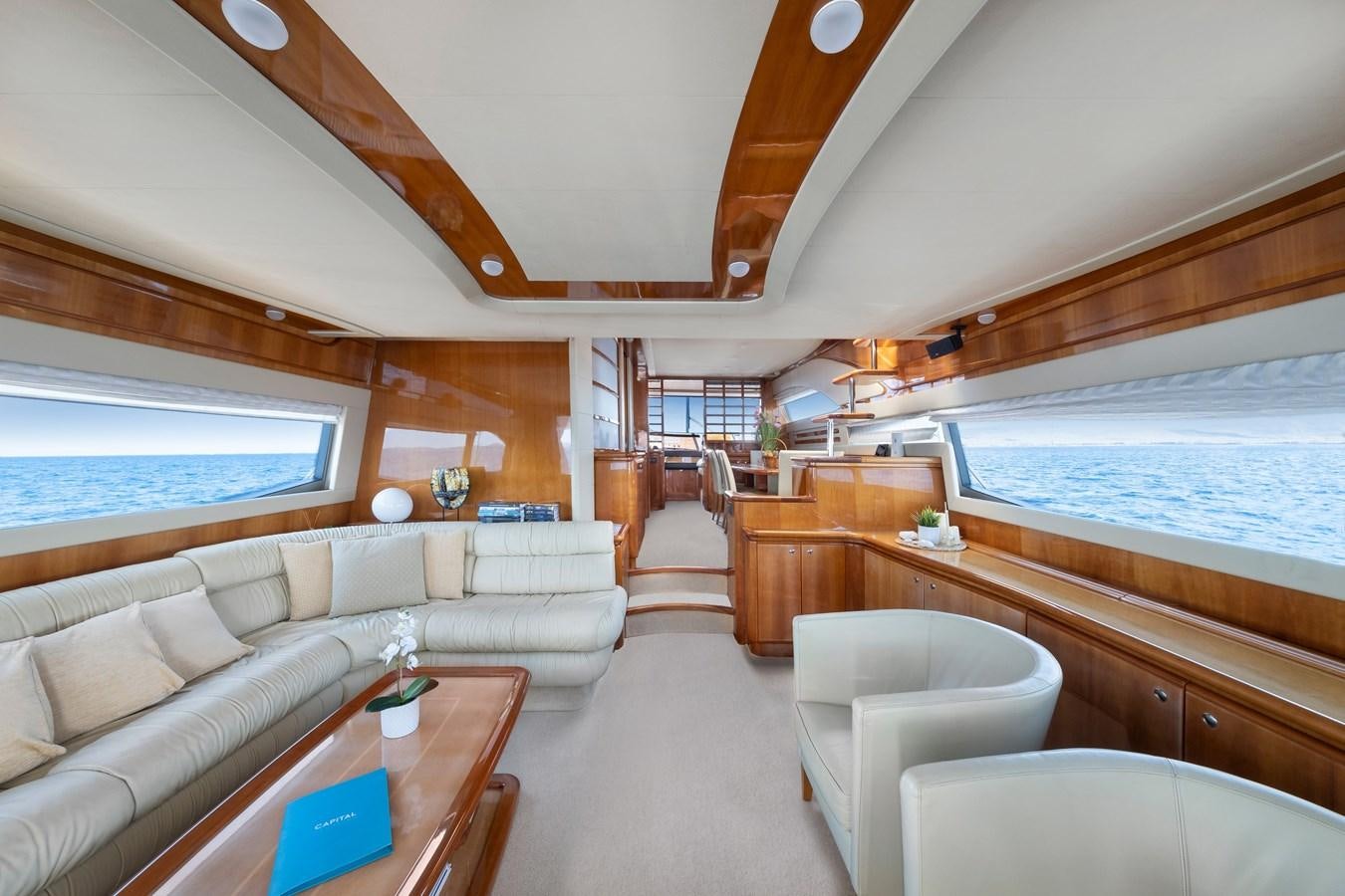 a large living room with a large bed and a large window aboard HARVESTER Yacht for Sale