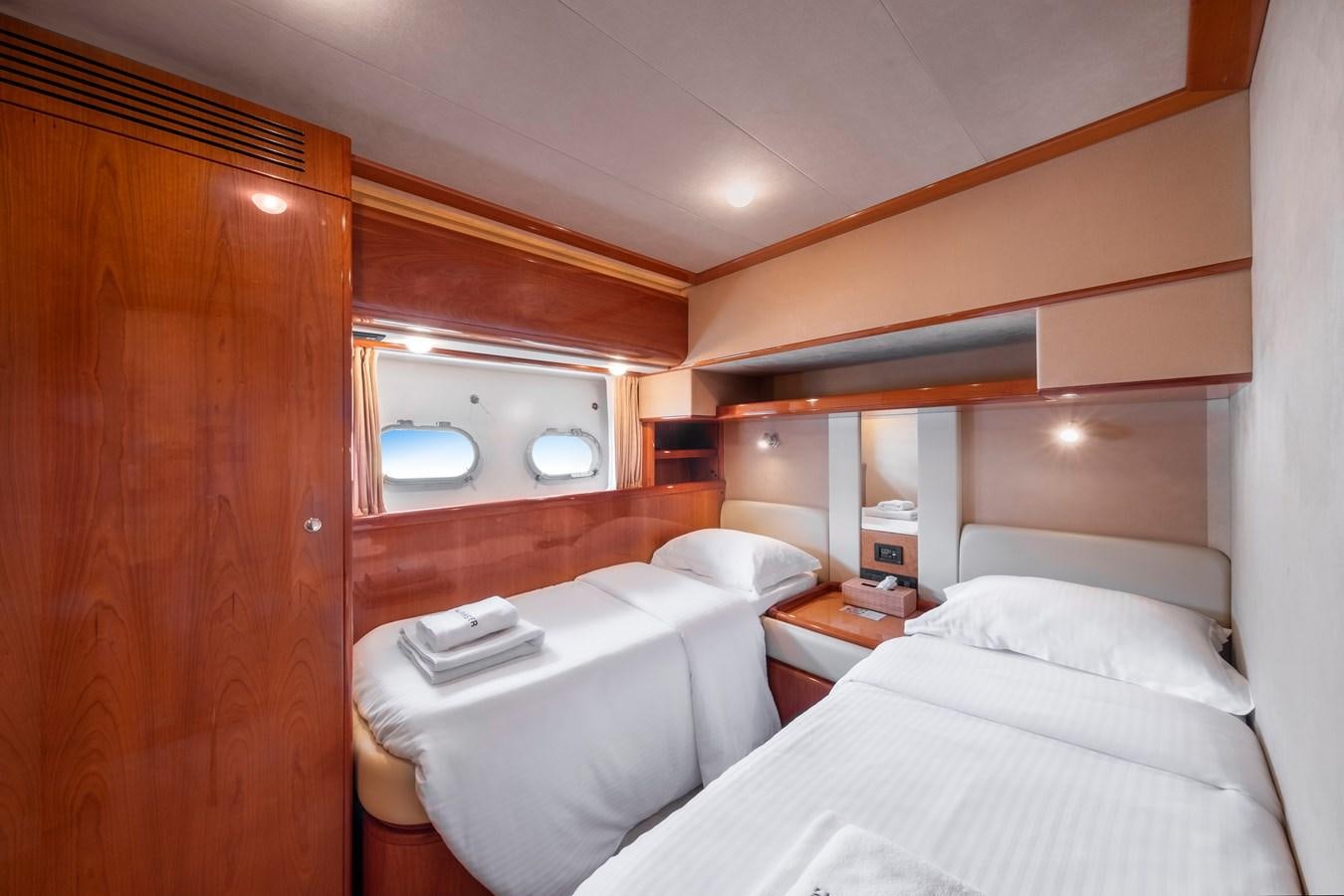 a room with two beds aboard HARVESTER Yacht for Sale