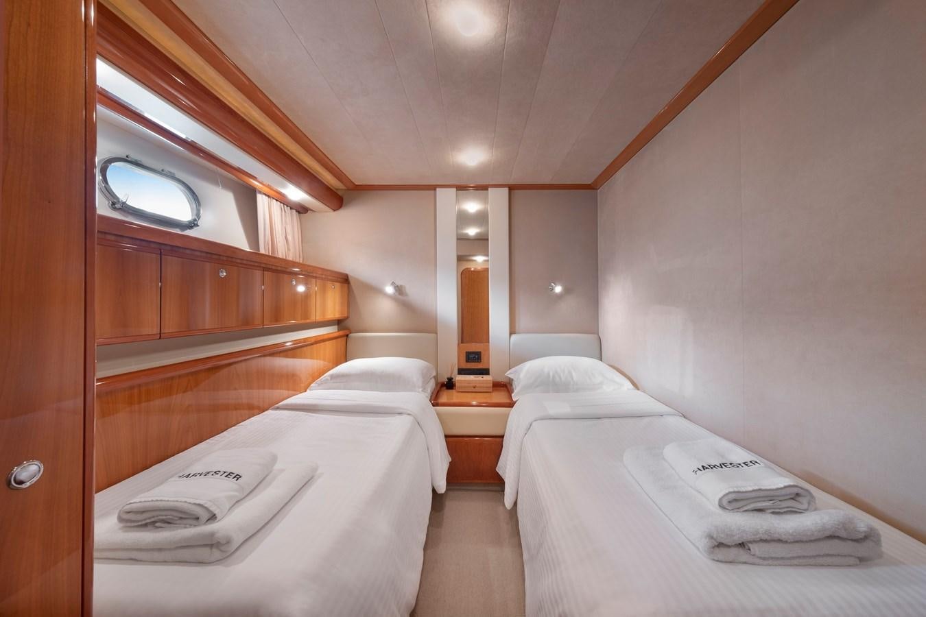 a room with two beds aboard HARVESTER Yacht for Sale