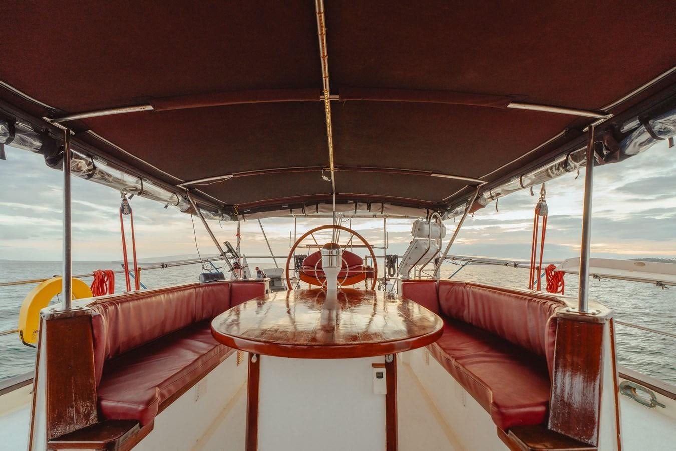 a boat with a red steering wheel aboard SJOSTROM Yacht for Sale