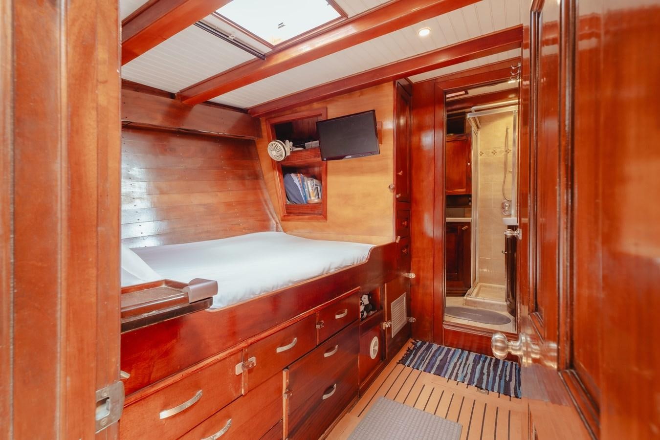 a room with a bed and a tv on the wall aboard SJOSTROM Yacht for Sale