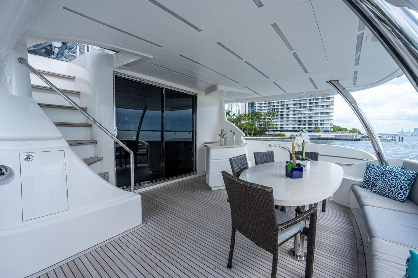 a room with a table and chairs aboard MOIRA CINCO Yacht for Sale