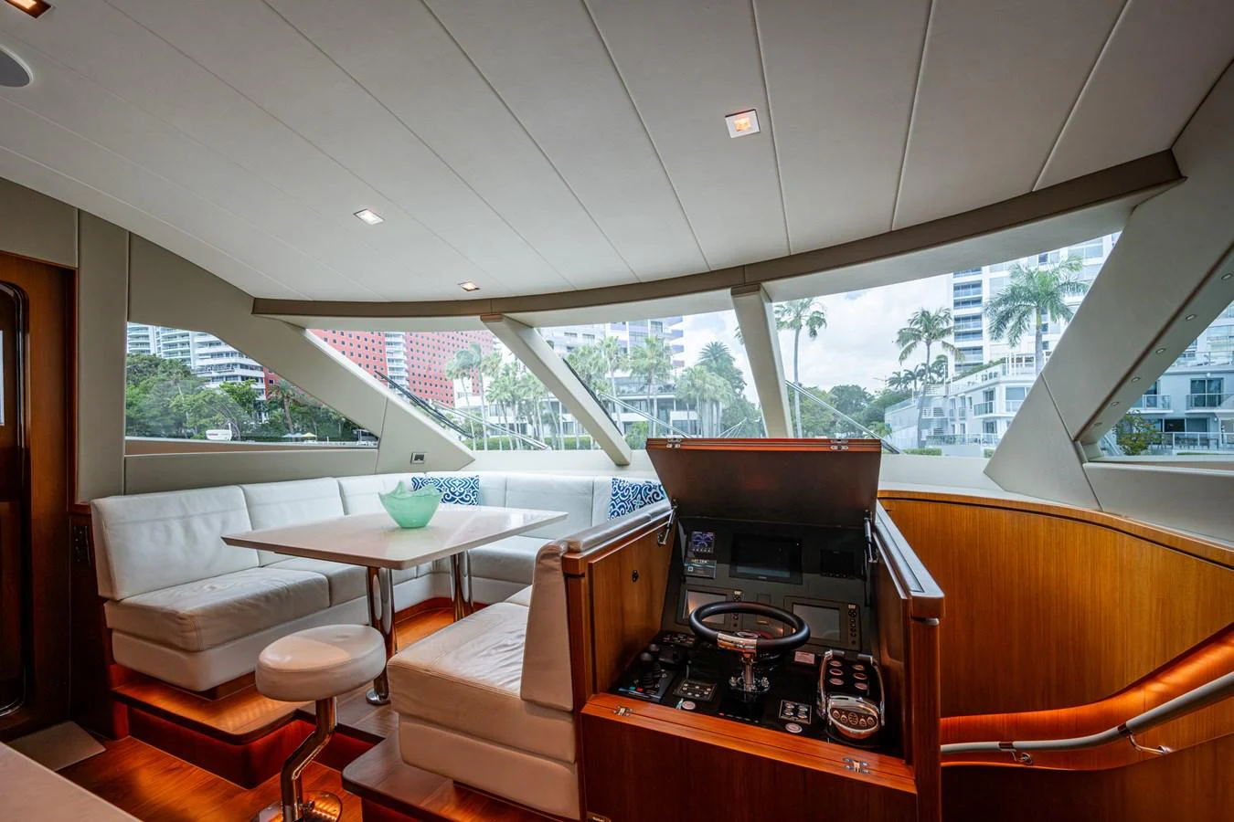 a kitchen with a stove and chairs aboard MOIRA CINCO Yacht for Sale