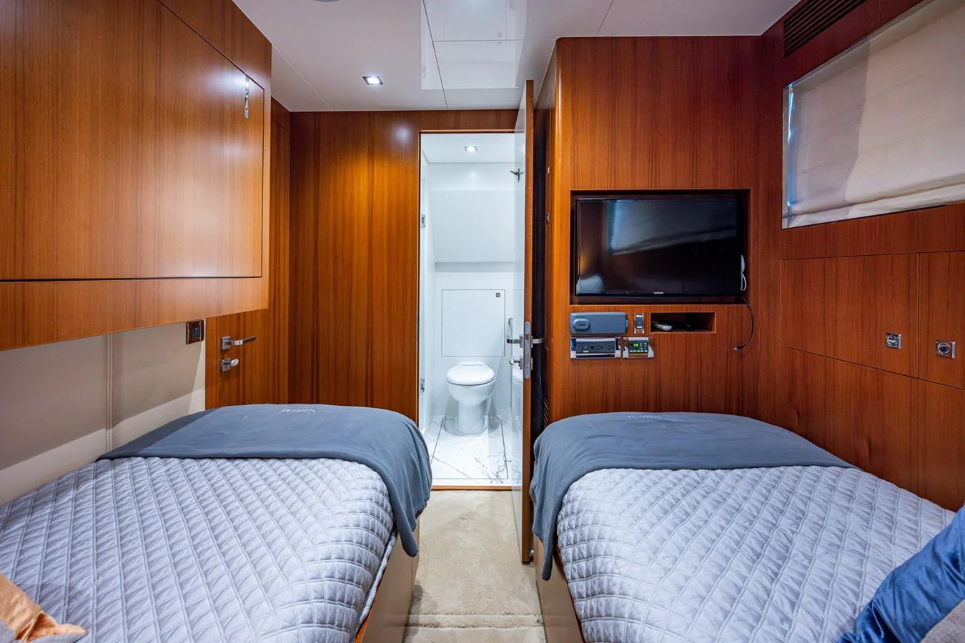 a room with a bed and a television aboard MOIRA CINCO Yacht for Sale