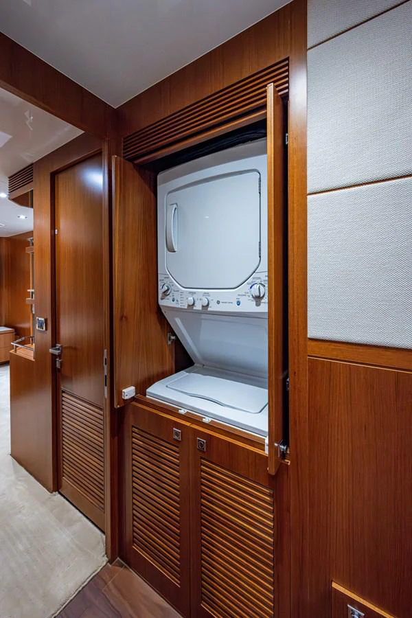 a microwave oven in a wooden cabinet aboard MOIRA CINCO Yacht for Sale