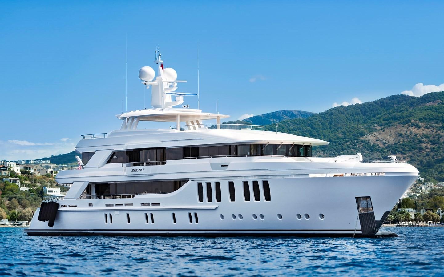 a white yacht in the water aboard LIQUID SKY Yacht for Sale