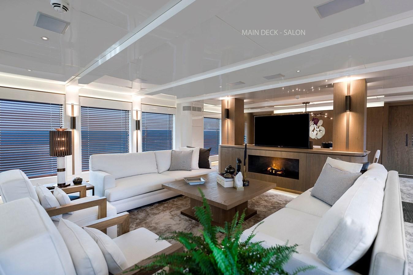 a living room with a fireplace aboard LIQUID SKY Yacht for Sale