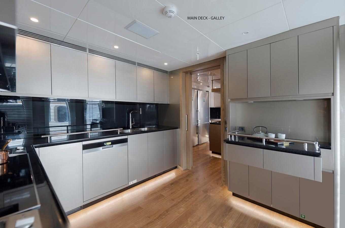 a kitchen with white cabinets aboard LIQUID SKY Yacht for Sale