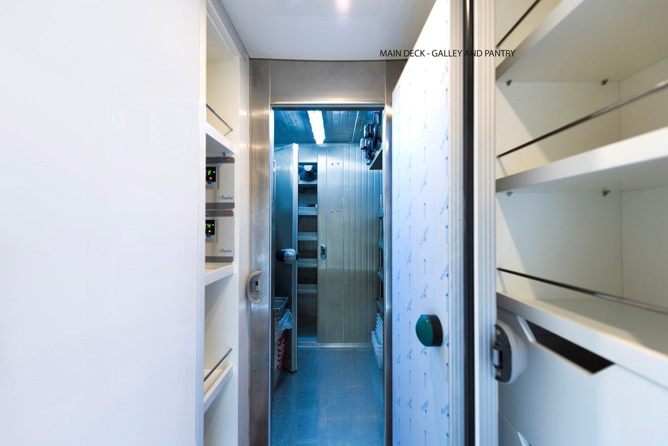 a hallway with doors aboard LIQUID SKY Yacht for Sale