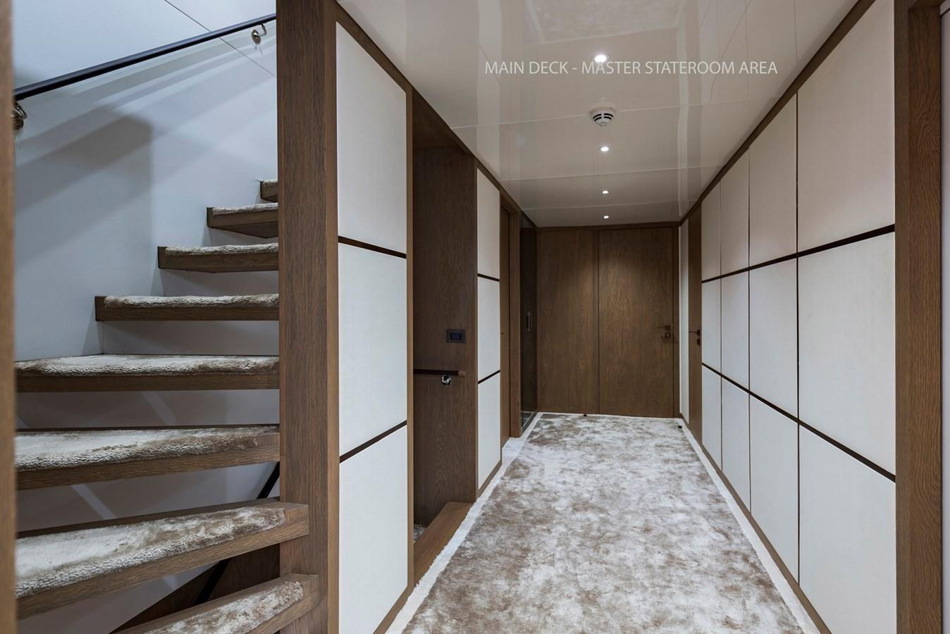 a room with a staircase and a bed aboard LIQUID SKY Yacht for Sale