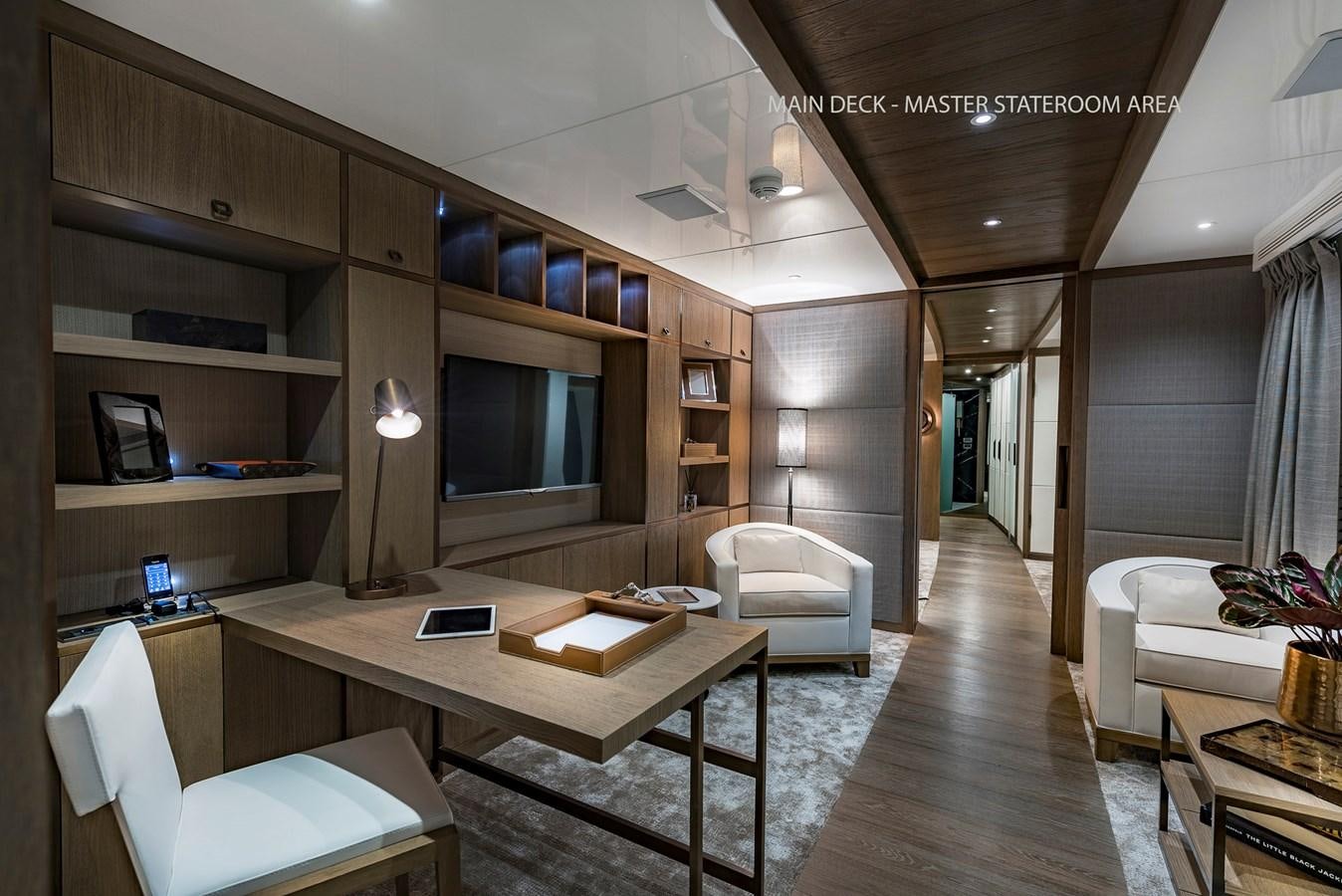 a room with a desk and a tv aboard LIQUID SKY Yacht for Sale