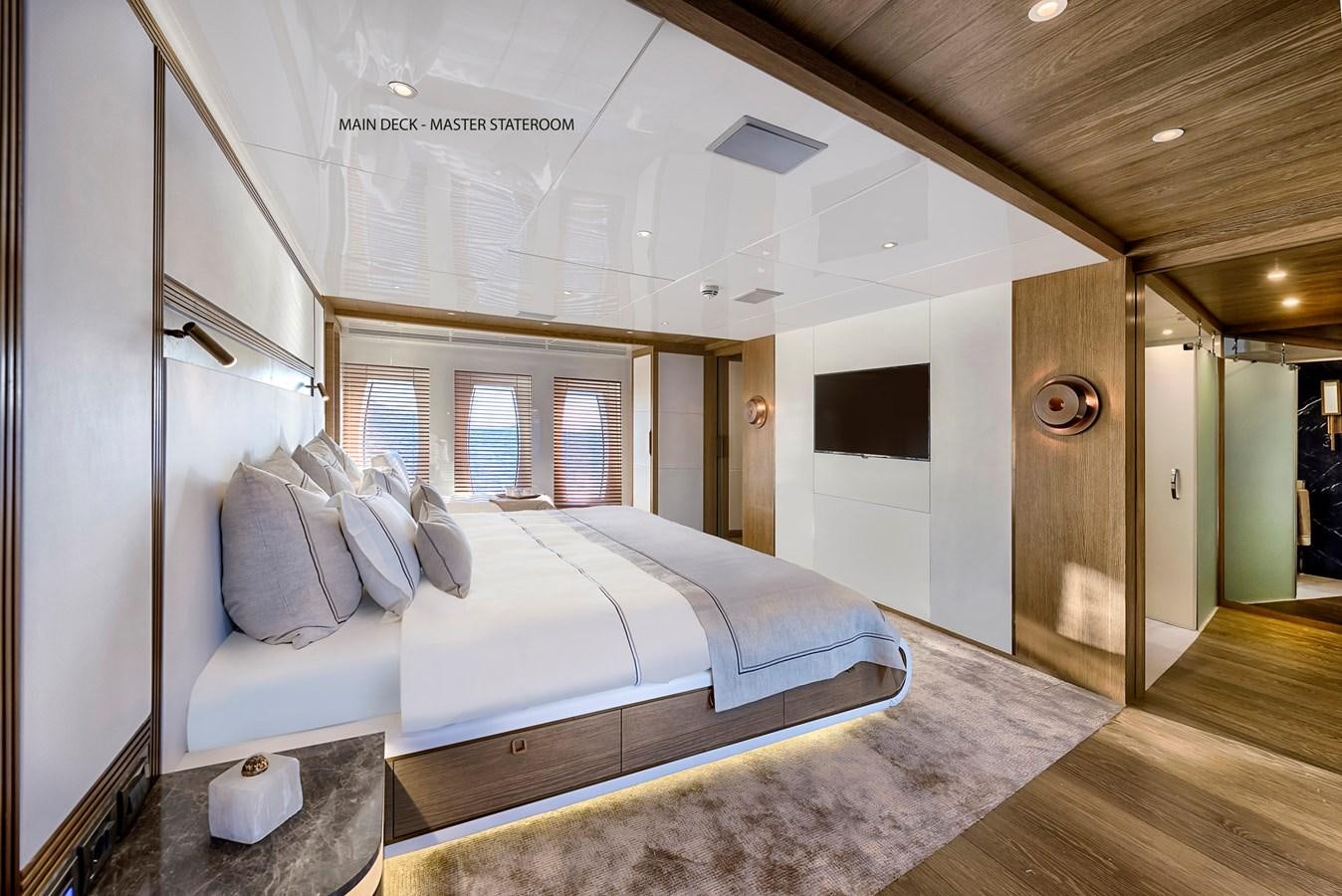 a large bed in a room aboard LIQUID SKY Yacht for Sale