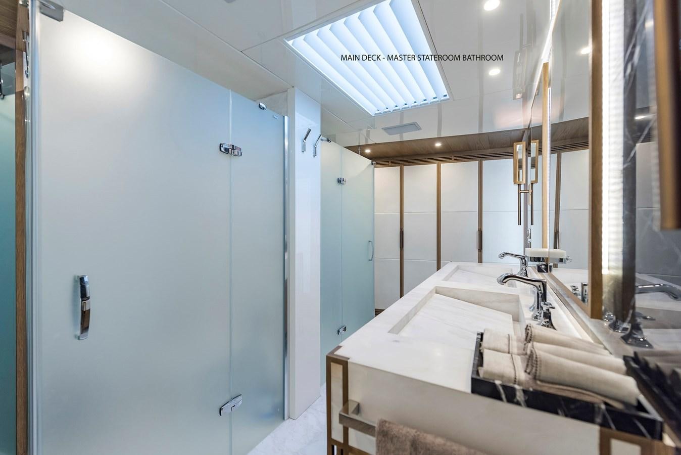 a bathroom with a countertop sink and cabinets aboard LIQUID SKY Yacht for Sale