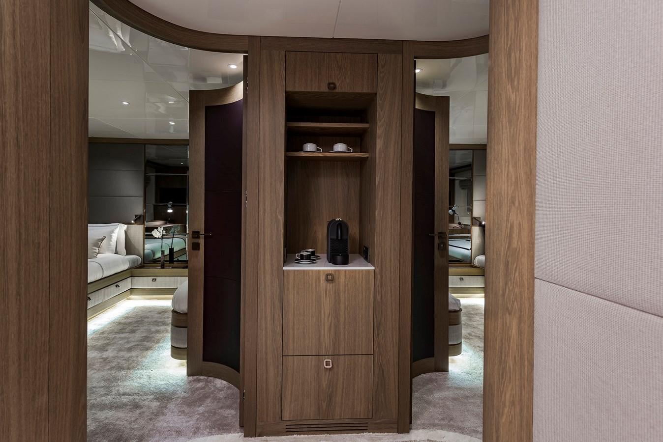 a room with a wood door and a mirror aboard LIQUID SKY Yacht for Sale