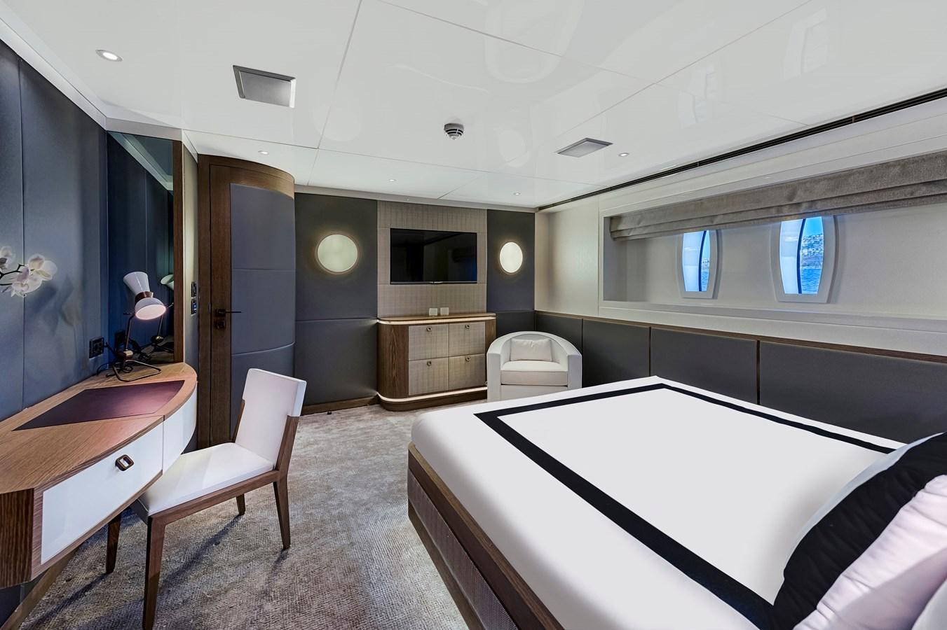 a room with a table and chairs aboard LIQUID SKY Yacht for Sale