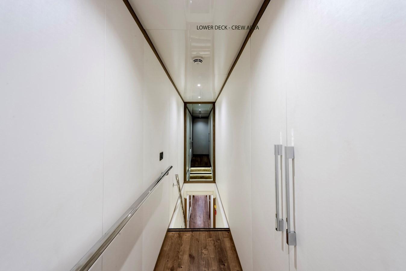 a hallway with a light aboard LIQUID SKY Yacht for Sale