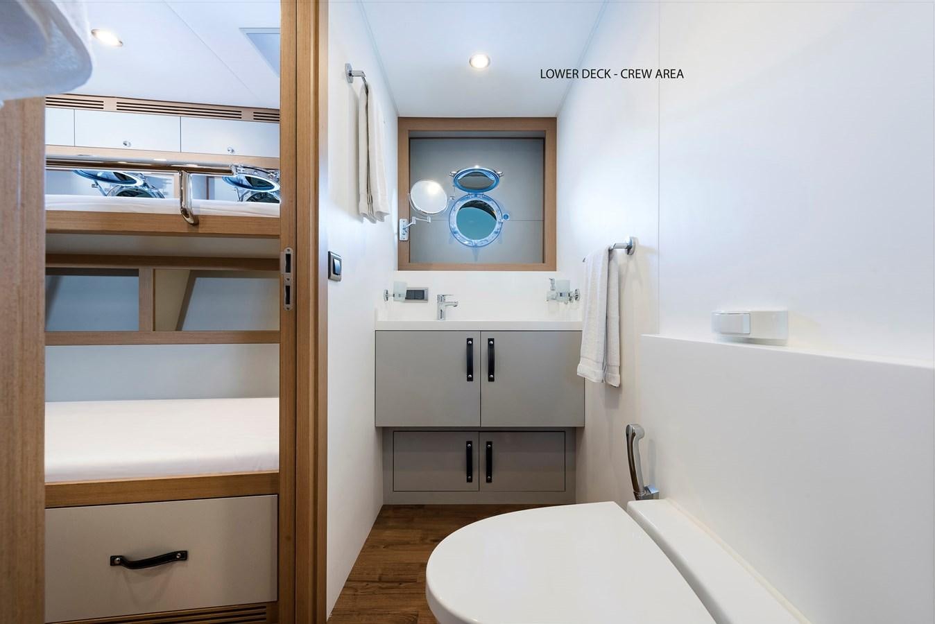 a bathroom with a sink and a mirror aboard LIQUID SKY Yacht for Sale