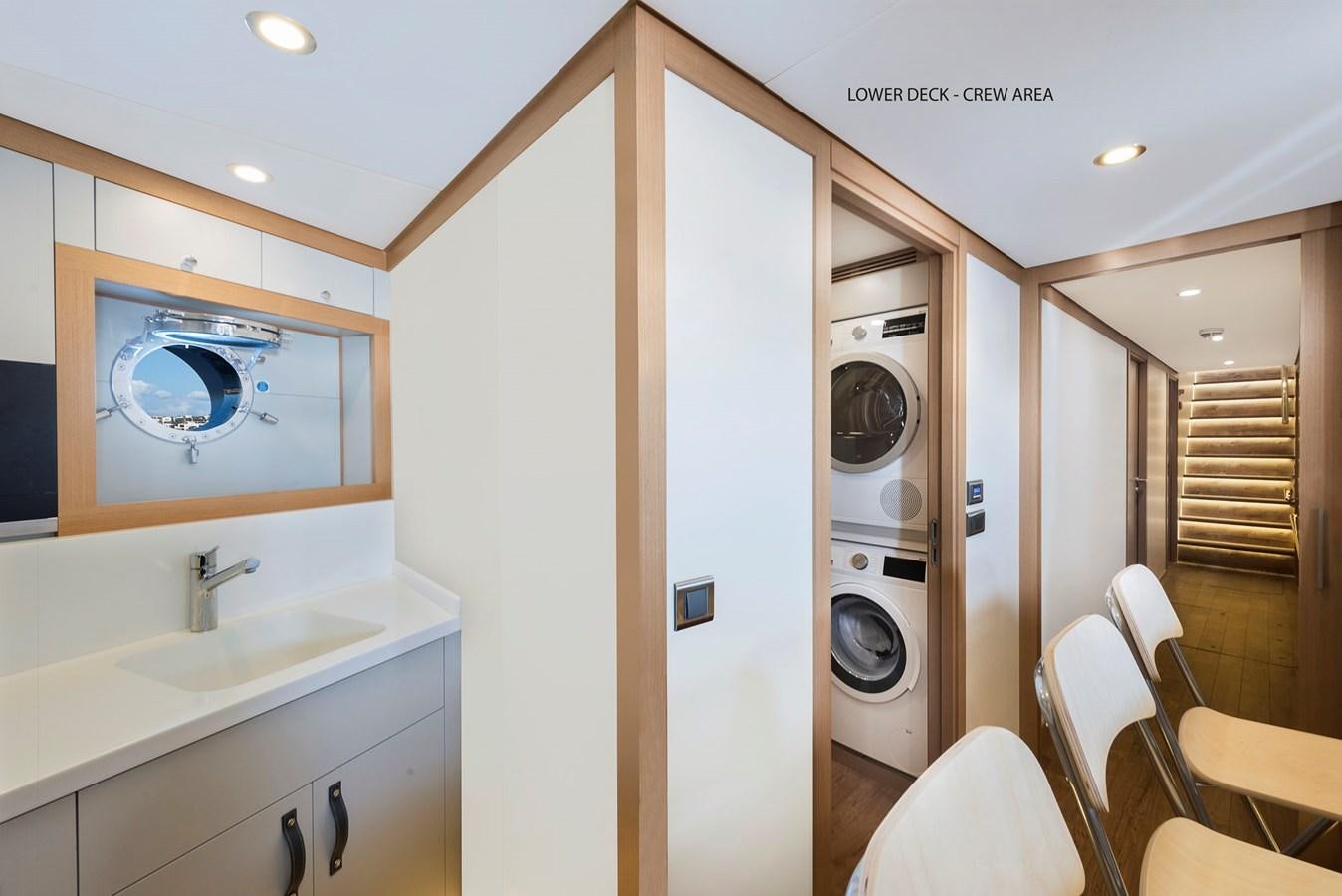 a room with a washing machine and sink aboard LIQUID SKY Yacht for Sale
