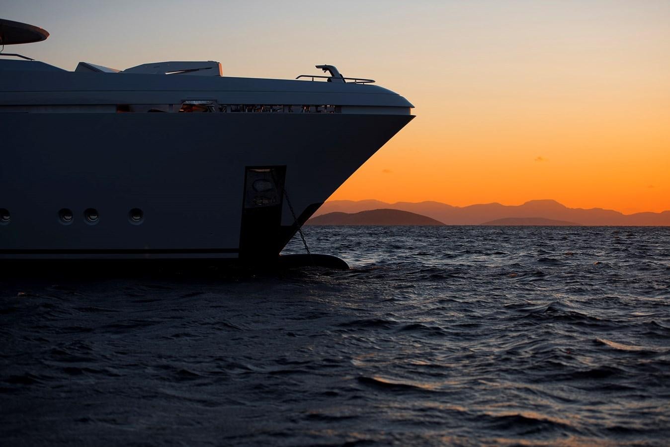 a large ship in the water aboard LIQUID SKY Yacht for Sale