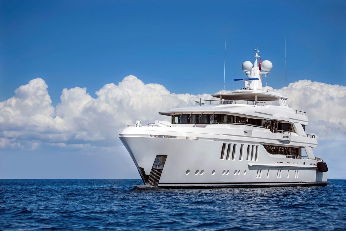 a white boat in the water aboard LIQUID SKY Yacht for Sale