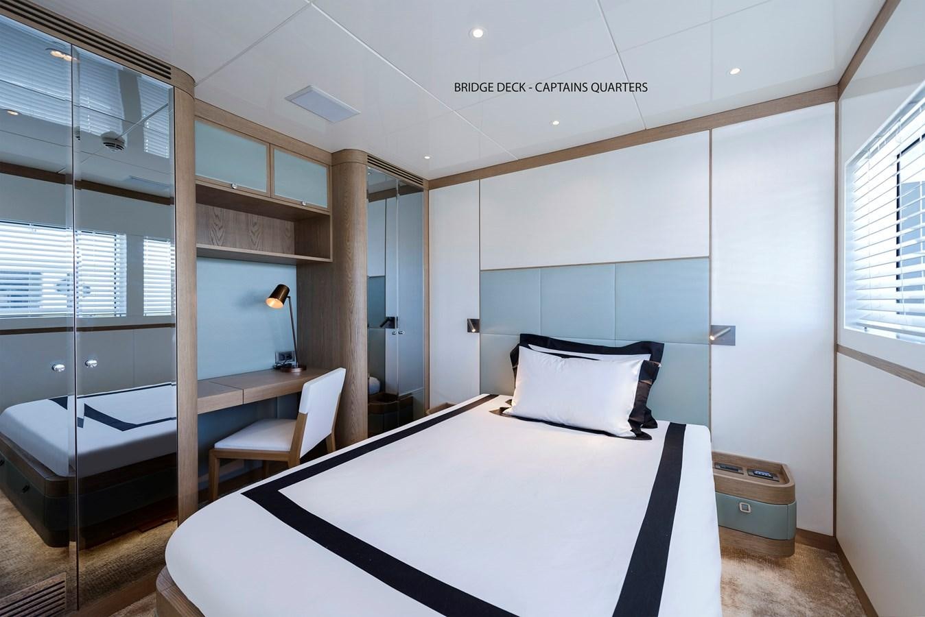 a bed in a room aboard LIQUID SKY Yacht for Sale
