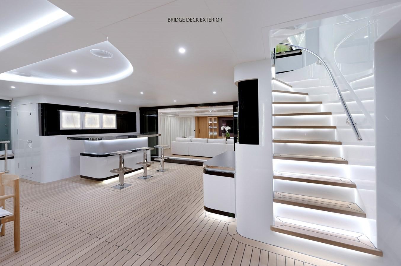 a modern looking room with a staircase aboard LIQUID SKY Yacht for Sale