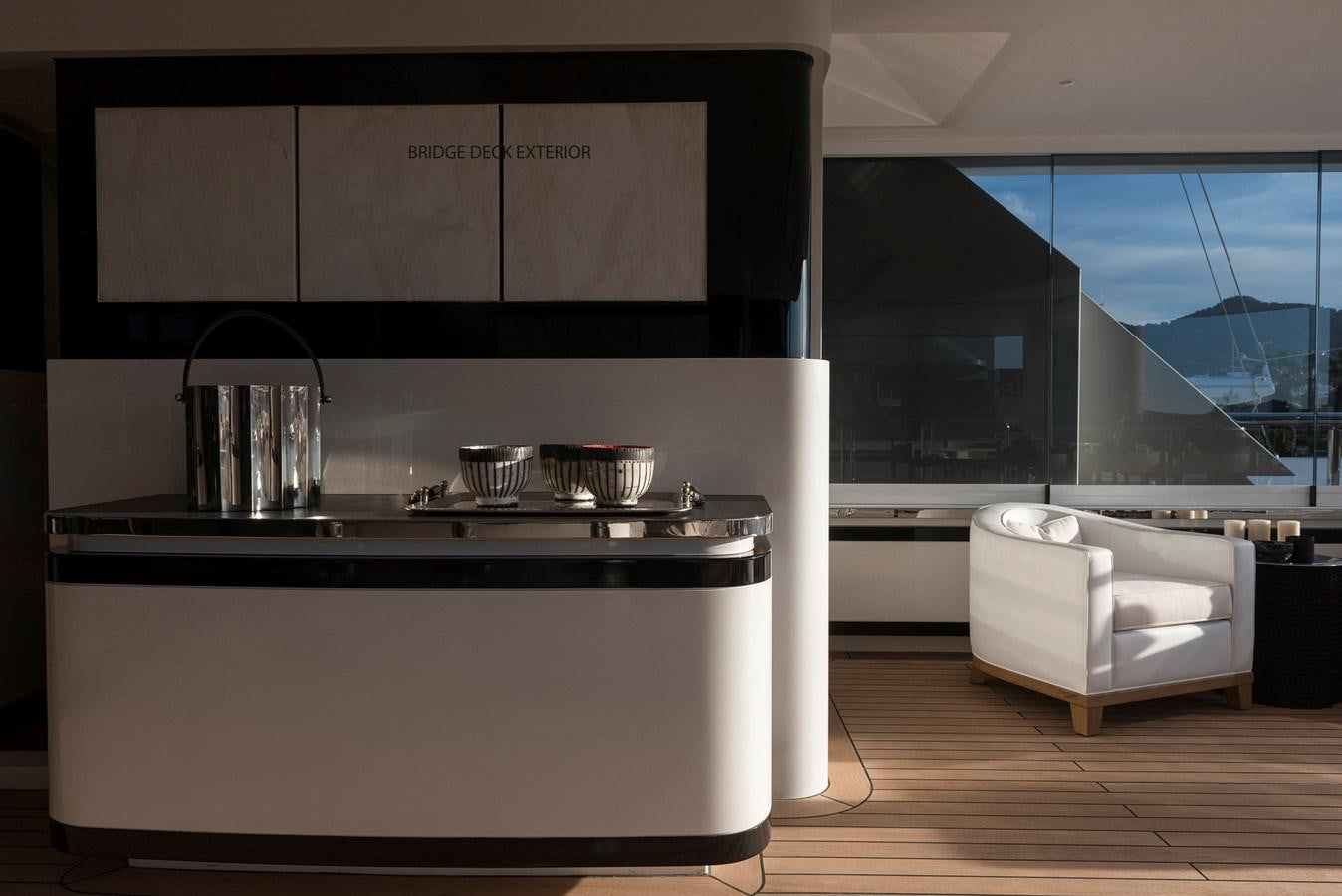 a kitchen with a large window aboard LIQUID SKY Yacht for Sale
