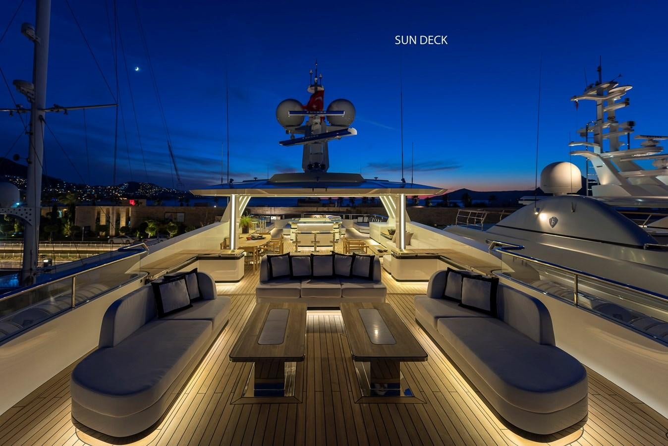a deck with a deck and a ship on it aboard LIQUID SKY Yacht for Sale