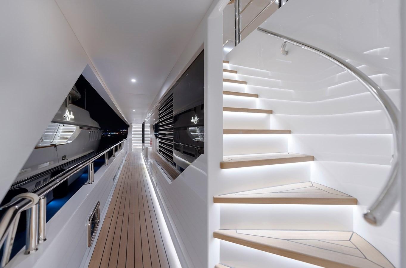 a white staircase in a building aboard LIQUID SKY Yacht for Sale