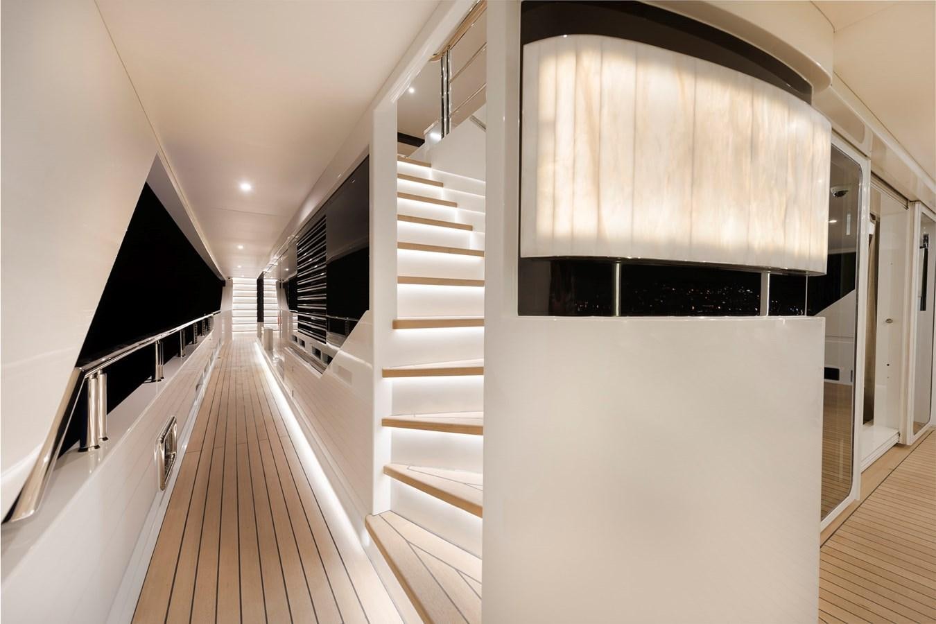 a hallway with a white staircase aboard LIQUID SKY Yacht for Sale