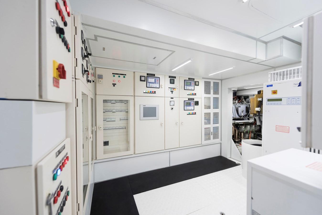 a kitchen with white cabinets aboard LIQUID SKY Yacht for Sale