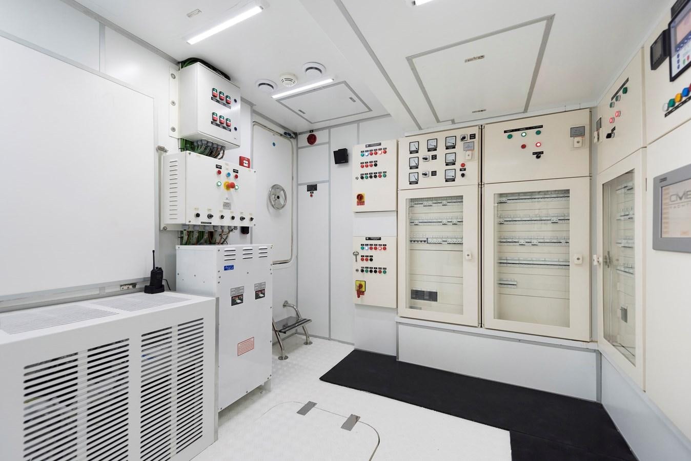 a room with white cabinets aboard LIQUID SKY Yacht for Sale