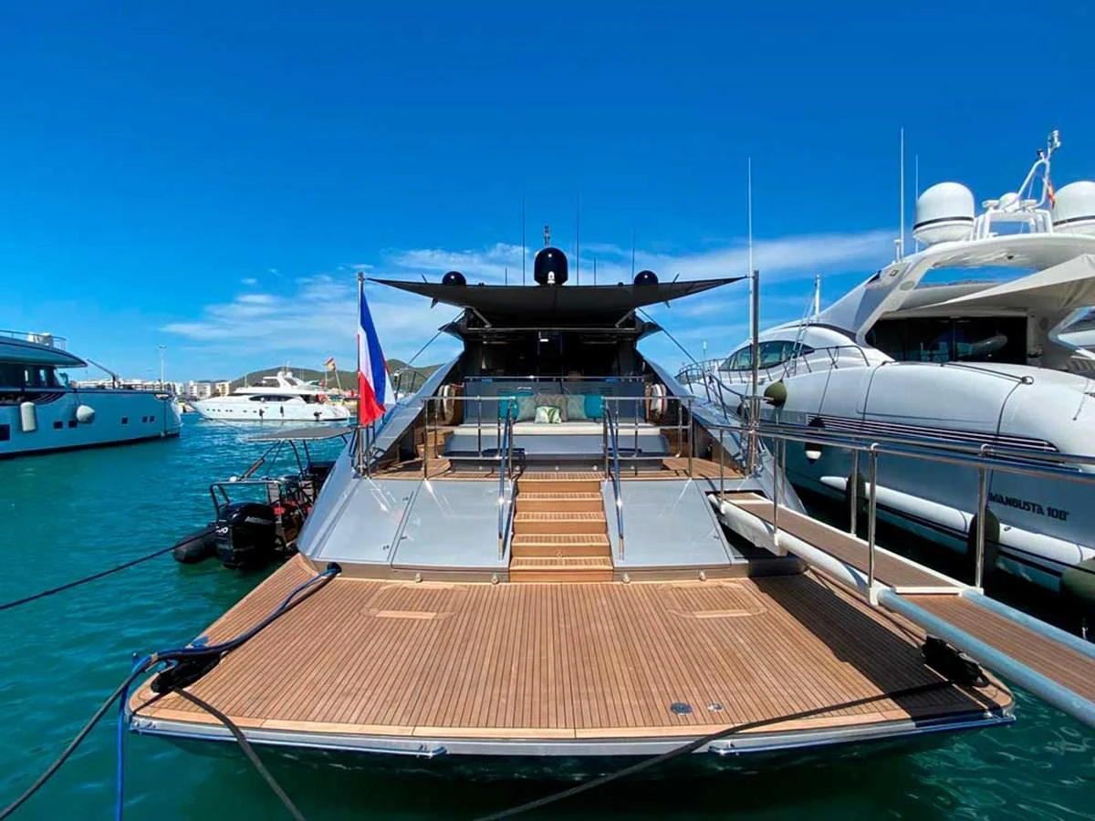 a boat docked at a pier aboard ESCAPE Yacht for Sale