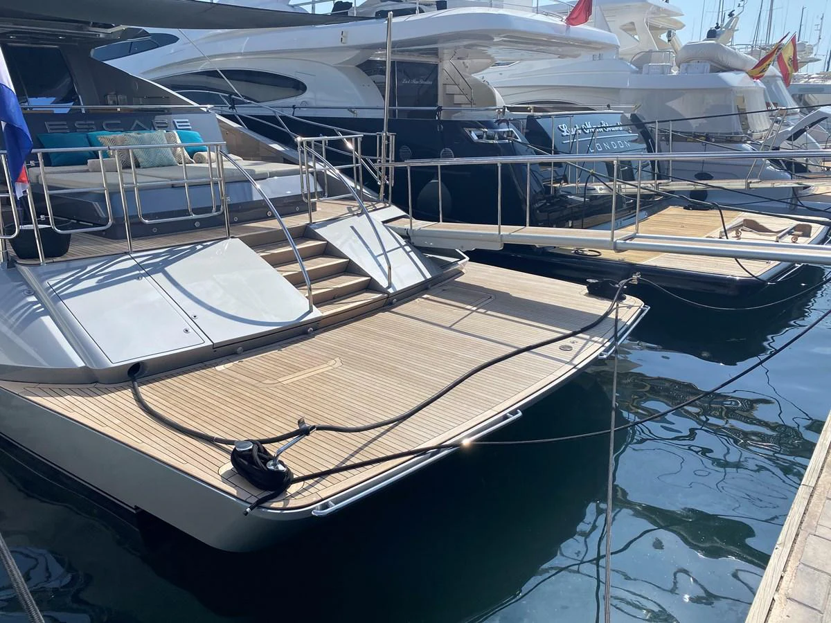 a boat docked at a pier aboard ESCAPE Yacht for Sale