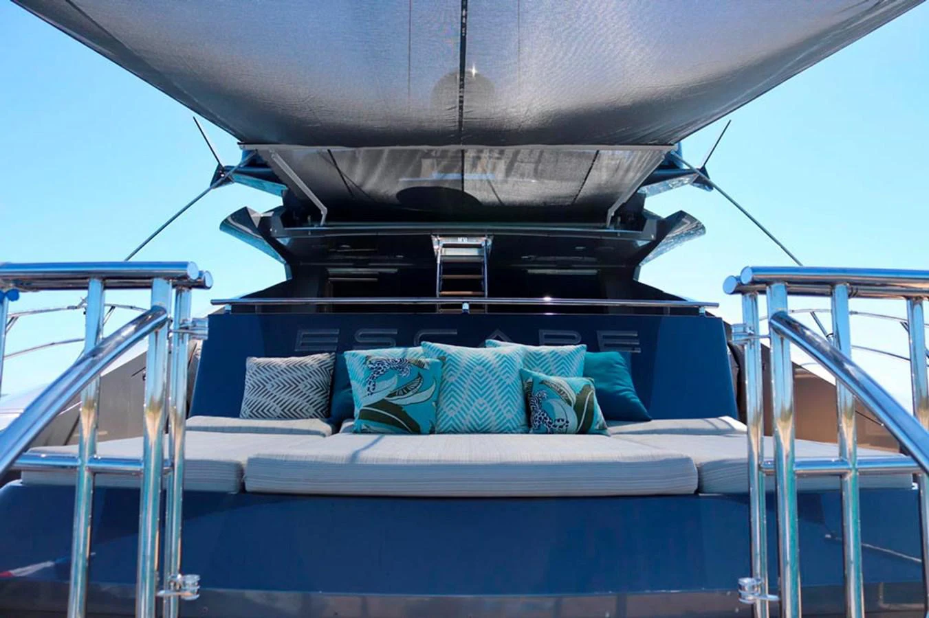 a boat with pillows on the deck aboard ESCAPE Yacht for Sale