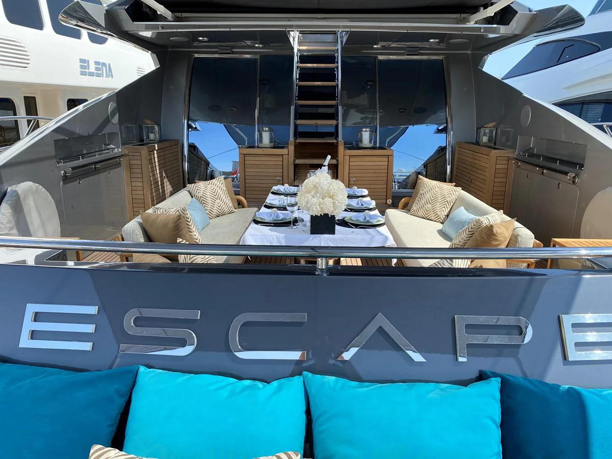 a boat with a couch and a chair in the front aboard ESCAPE Yacht for Sale