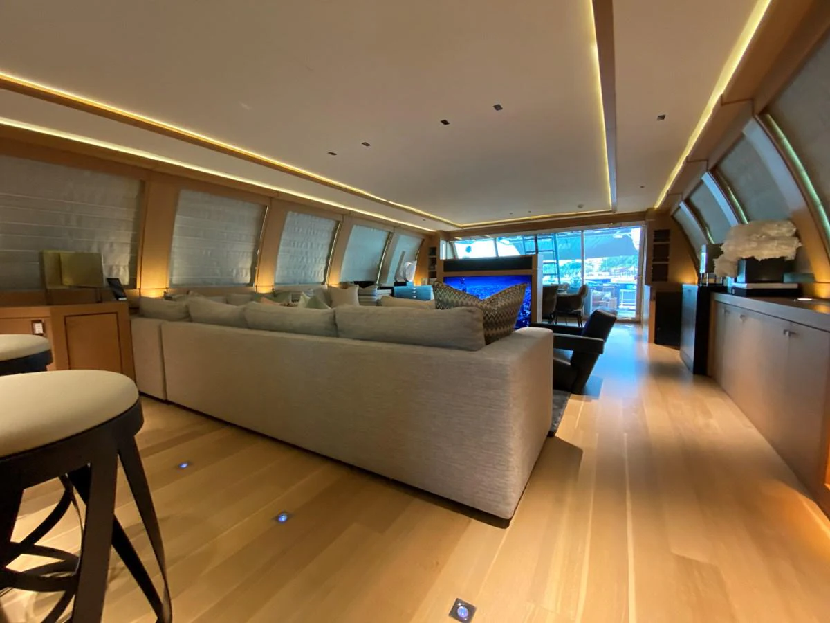 a living room with a large window aboard ESCAPE Yacht for Sale