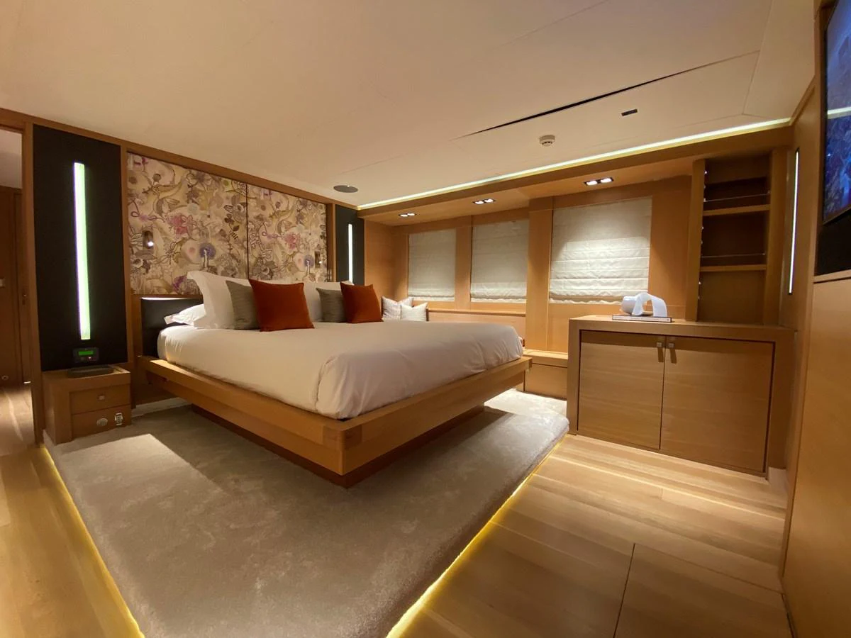 a large bedroom with a large bed aboard ESCAPE Yacht for Sale