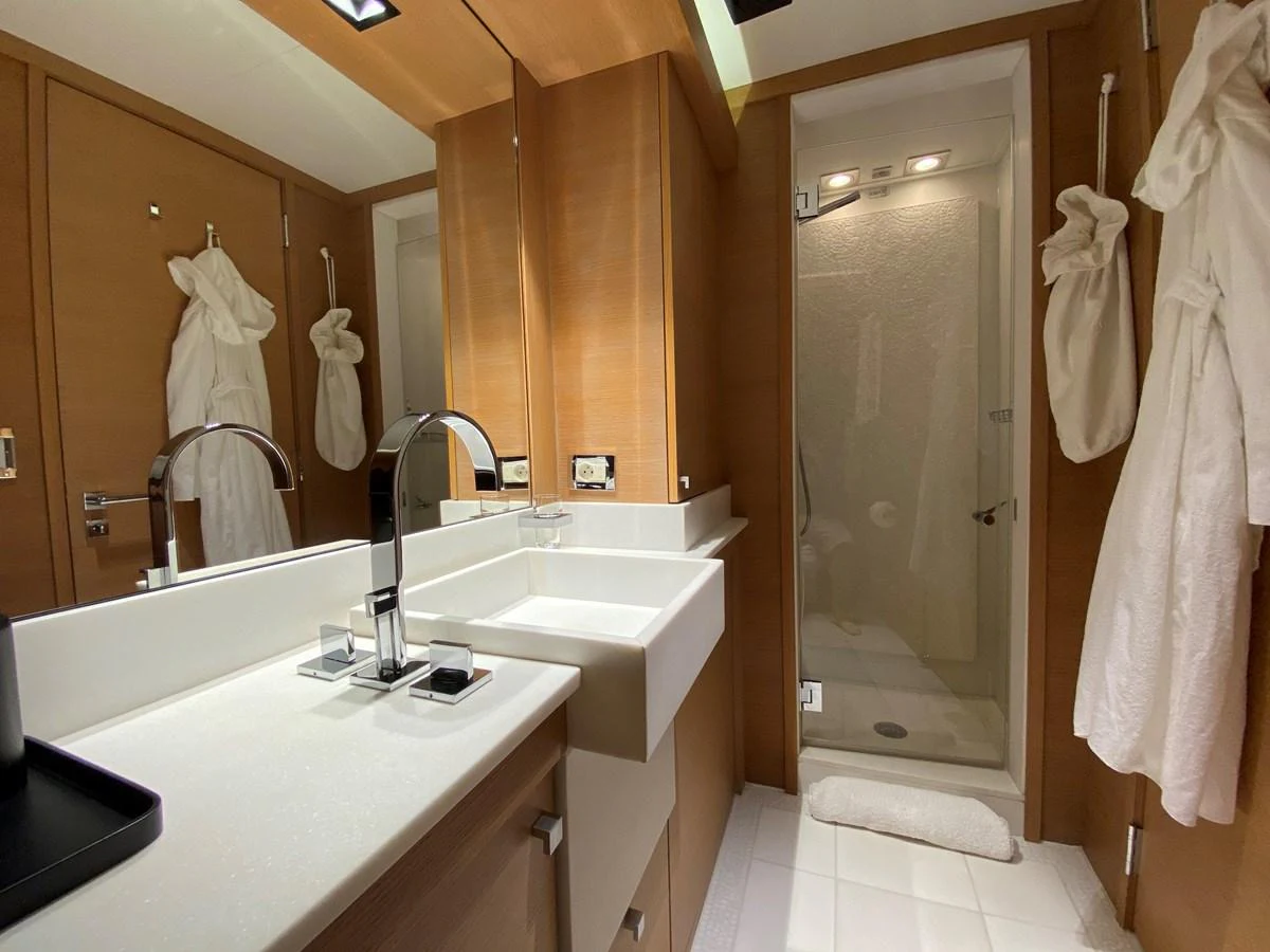 a bathroom with a sink and a shower aboard ESCAPE Yacht for Sale